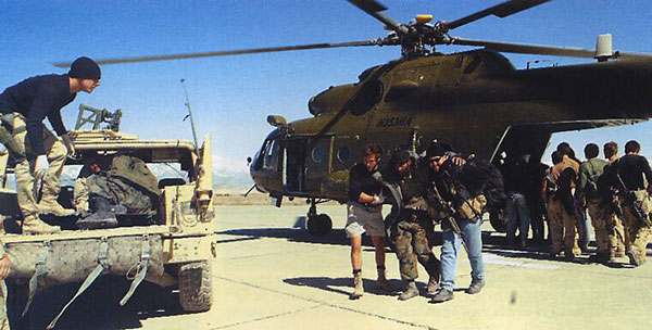 U.S. special forces help Northern Alliance troops away from a CIA-operated MI-17 Hip helicopter at Bagram Airbase