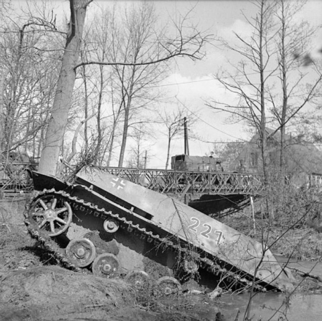 Early April 1945, the English Army roll past destroyed German armour in the town of Dreierwalde. (Alamy)