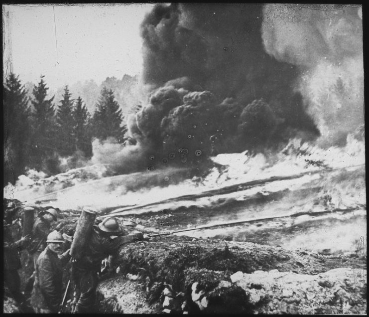 French soldiers making a gas and flame attack on German trenches in Flanders.