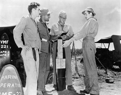 1st Lt. James E. Swett, with other members of his VMF-221 squadron, describing his Medal of Honor actions.