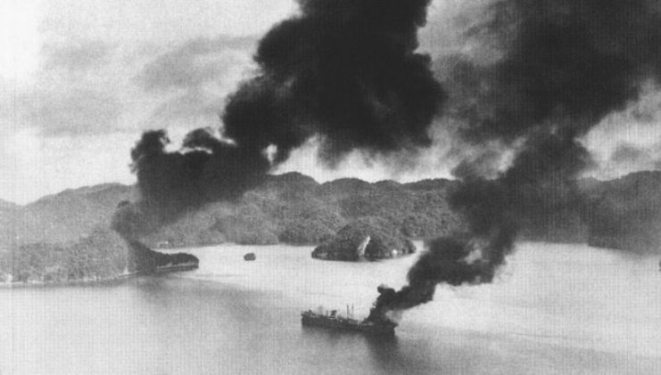 The Japanese merchant ship Nagisan Maru burns in the Palau Islands. The ship was sunk during the U.S. Navy’s “Operation Desecrate One” by three Grumman TBM-1C Avengers of Torpedo Squadron 31 (VT-31) from the light aircraft carrier USS Cabot (CVL-28).