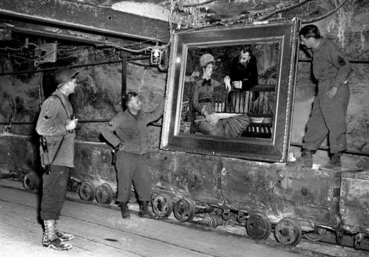 American Soldiers looking at art. Photo by National Archives.