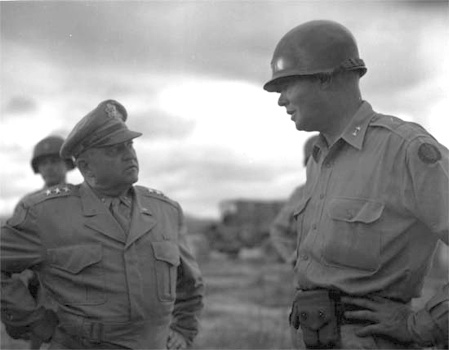 Lt. Gen. Walker (left) confers with Maj. Gen. William F. Dean, Commander of the 24th Infantry Division, on July 7, 1950