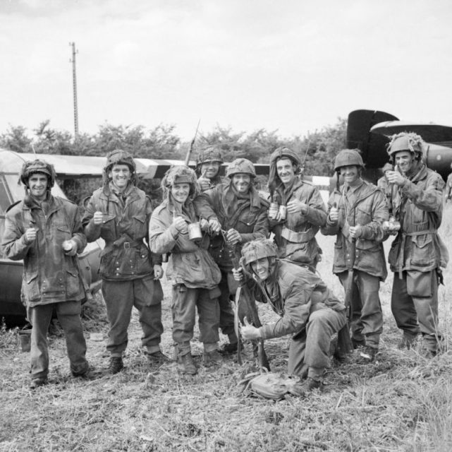 Members of 12th Parachute Battalion, 5th Parachute Brigade, 6th Airborne Division, enjoy a cup of tea after fighting their way back to their own lines after three days behind enemy lines in Normandy, June 10, 1944.