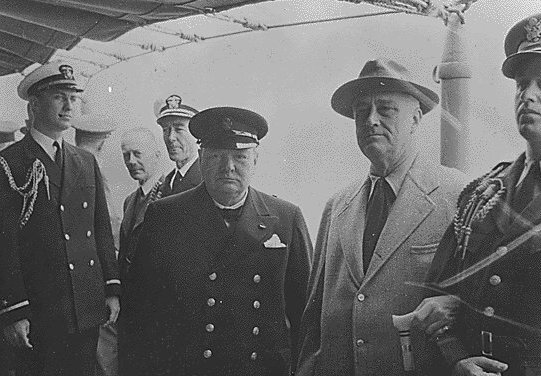 Prime Minister Winston Churchill and President Franklin Roosevelt aboard the U.S. S. Augusta, off the coast of Newfoundland.