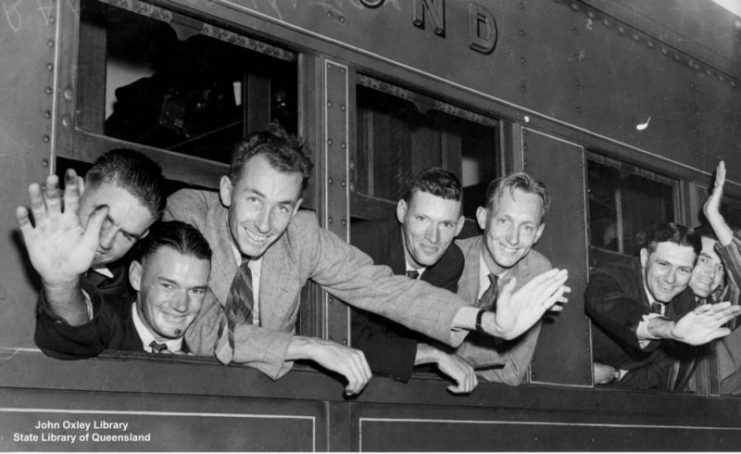 Recruits for the RAAF (Royal Australian Air Force) waving farewell to friends when they left Brisbane for the South to begin their training.