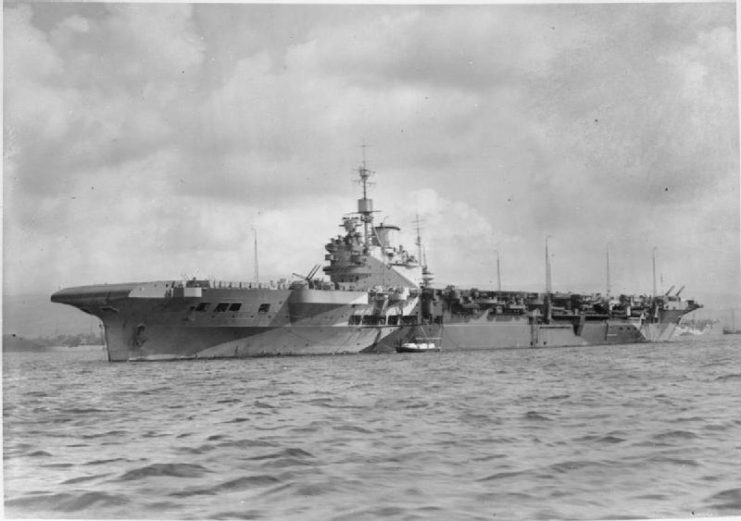 Oblique bow view of Illustrious at anchor