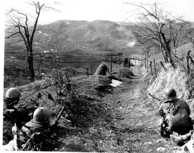 Division infantry cover for an assault squad in northern Italy.