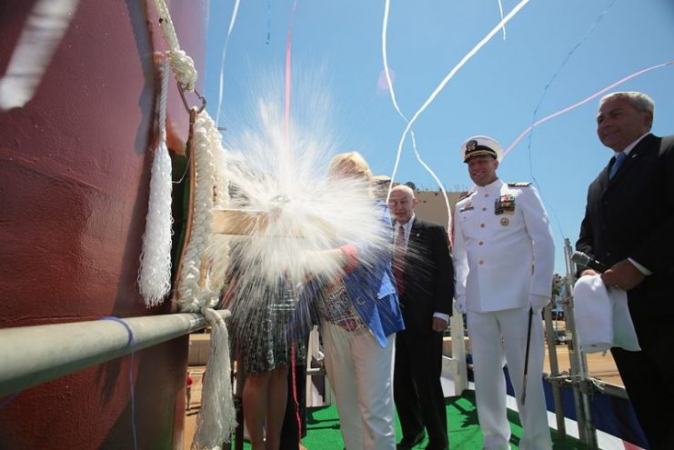 Sally Monsoor christens the future USS Michael Monsoor (DDG 1001), which is named in honor of her son, Medal of Honor recipient Navy Petty Officer 2nd Class (SEAL) Michael A. Monsoor.
