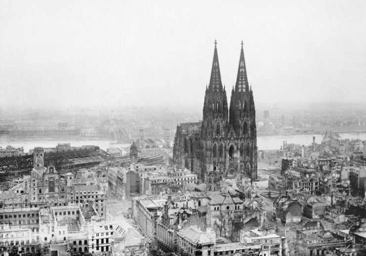 Cologne Cathedral stands intact amidst the destruction caused by Allied air raids, 9 March 1945.