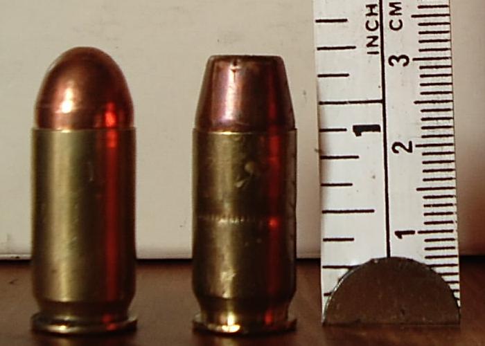 .45 ACP cartridges full metal jacket (left) and hollow-point (right).