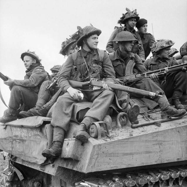 Infantry ride on Sherman tanks in Holland, 24 September 1944. Note the soldier in front with Lee-Enfield rifle.