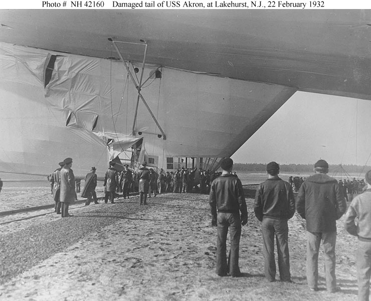 USS Akron (ZRS-4) Damage to the airship’s lower fin, 22 February 1932. Akron was being removed from her hangar at Naval Air Station Lakehurst, New Jersey, when the wind caused her tail to break loose from the rail car used for maneuvering the airship on the ground.