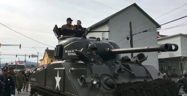 Clarence rides the tank through Allentown. Photo: Adam Makos.