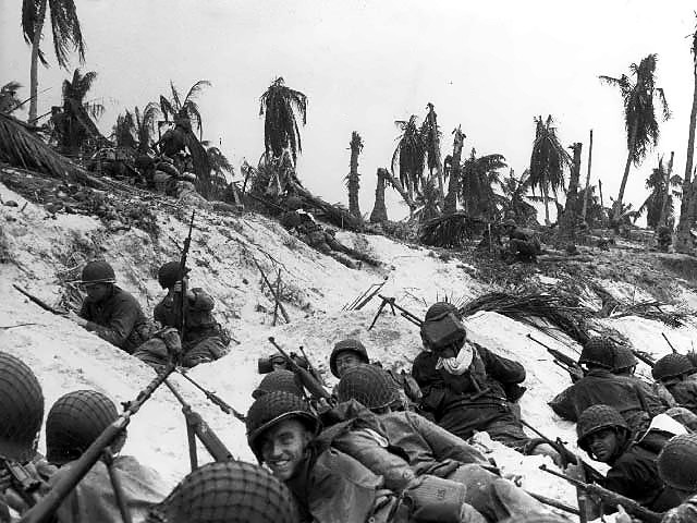 Eniwetok landing. US soldiers on the beach awaiting orders to attack.