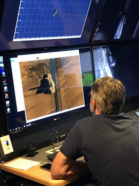 Director of Subsea Operations, Robert Kraft, inspecting a sonar image. Photo courtesy of Paul G. Allen’s Vulcan Inc.