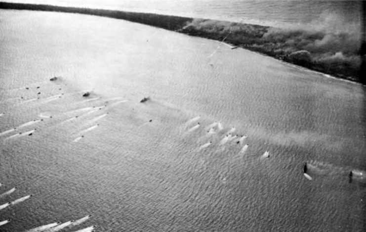 Landing craft pass supporting warships in the Battle of Eniwetok, 19 February 1944.