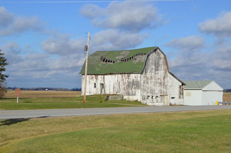 Overview of the site of the Battle of Phillips Corners at the junction of State Routes 109 and 120, just east of Lyons, in Royalton Township, Fulton County, Ohio, United States. During the Toledo War, this spot witnessed the incident that came closest to bloodshed. A historical marker at far left commemorates the event.