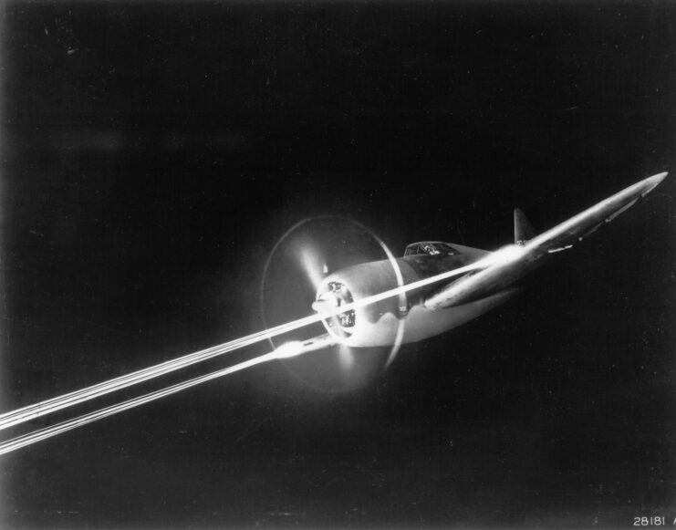 Republic P-47 Thunderbolt firing its M2 Browning machine guns in flight