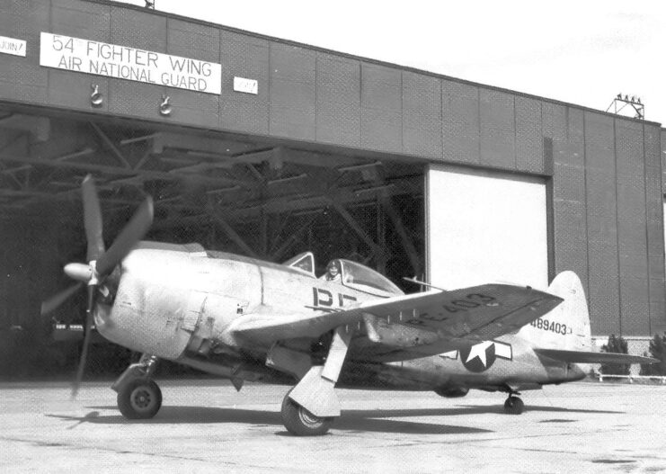 Republic P-47N-25-RE Thunderbolt parked outside of an airport hangar