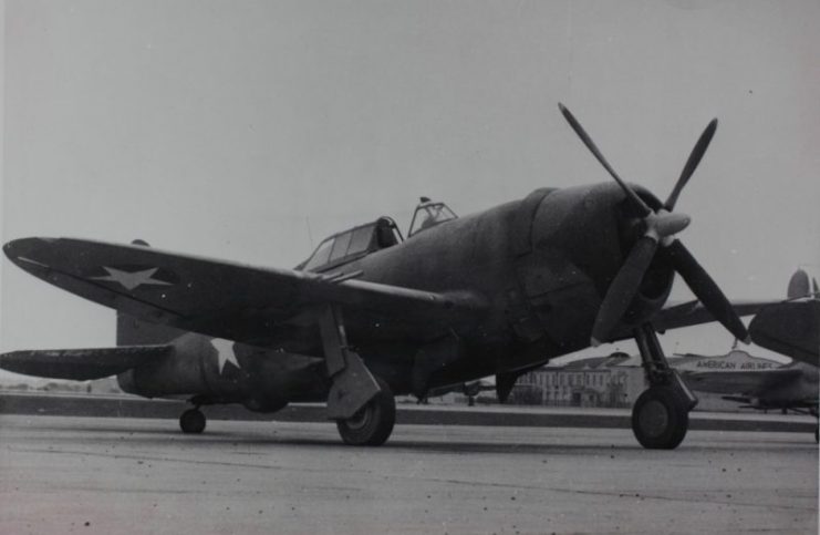 Republic P-47C Thunderbolt On a tarmac with an American Airlines’ hanger in the lower right in the photo