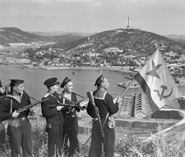 Pacific Fleet marines of the Soviet Navy hoisting the Soviet naval ensign in Port Arthur on October 1, 1945.