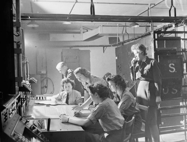 This image shows the receiver station at RAF Bawdsey, the home of CH development. It is commanded by Flight Officer Wright, on the phone. The radar operator is just visible in the background, just right of centre.