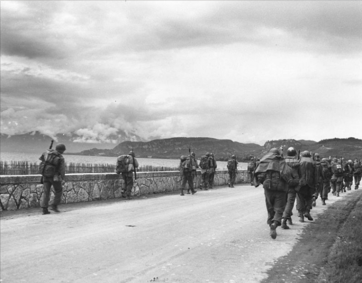 Members of the 86th Infantry Regiment, 10th Mountain Division, march north, near Malcesine, on Lake Garda, without meeting any resistance. Rearguard action is all that has been encountered so far. April 29, 1945.