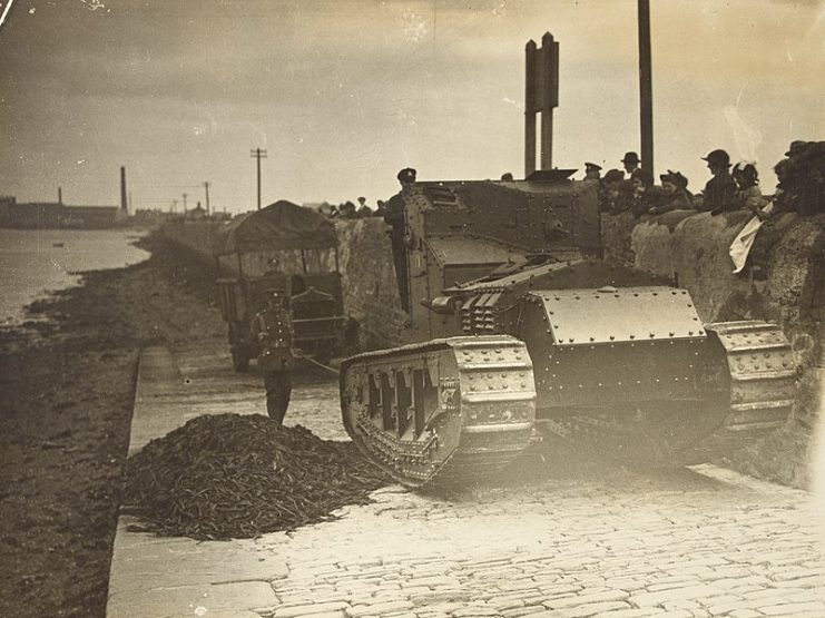 Tank pulling a three-ton military truck from the banks of the Liffey.