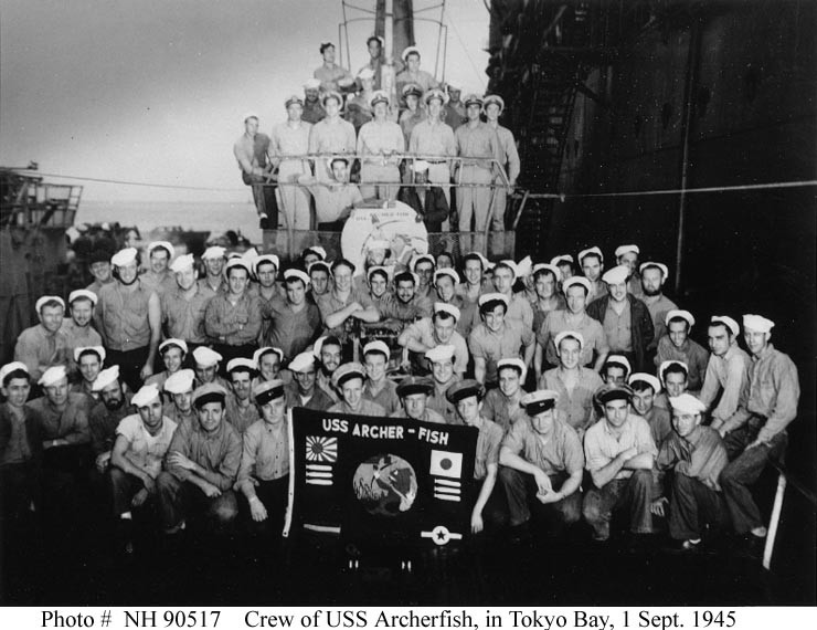 USS Archerfish (SS-311)’s crew pose on board, while she was alongside USS Proteus (AS-19) in Tokyo Bay, 1 September 1945.