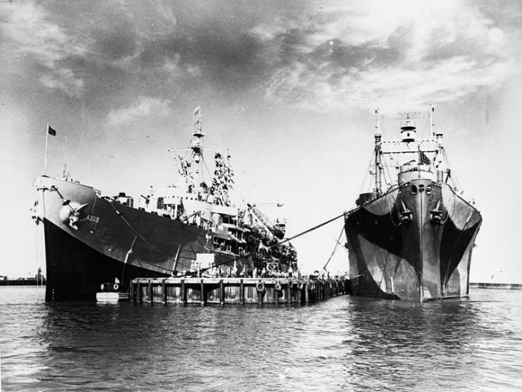 The U.S. Navy submarine tender USS Proteus (AS-19), left, at Midway, sometime between 3 May and 1 December 1944. USS Aegir (AS-23) is at right.