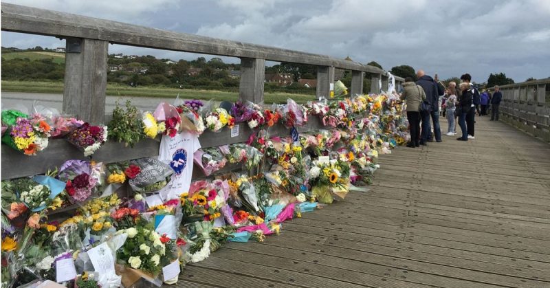 Floral tributes to those who died, on Shoreham Tollbridge near the site of the crash. Photo: HarrisonS4433 / CC-BY-SA 3.0