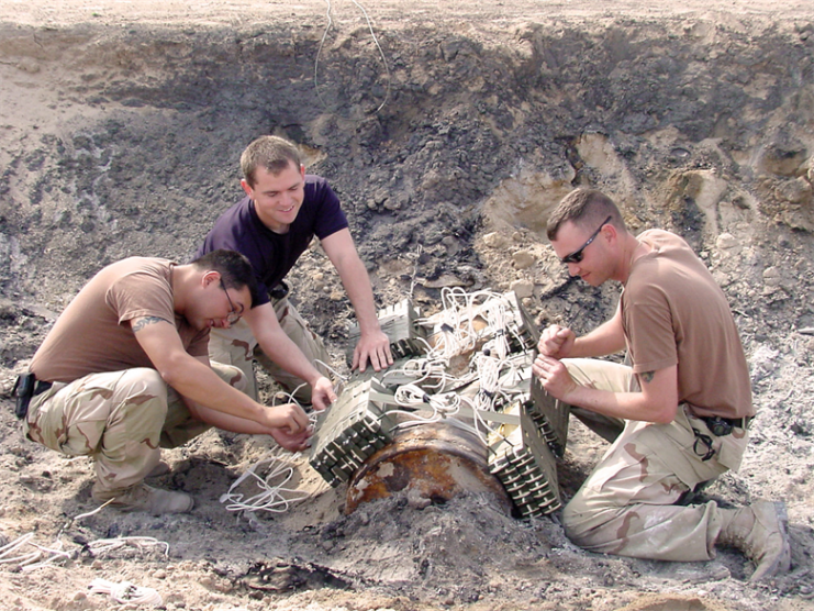 Southwest Asia – Staff Sgts. Jason Wilburn, Joseph Leslie and Brad Ferguson prepare to detonate a Russian-made bomb that was discovered by an Airman at a construction site at a forward-deployed location. (U.S. Air Force photo)