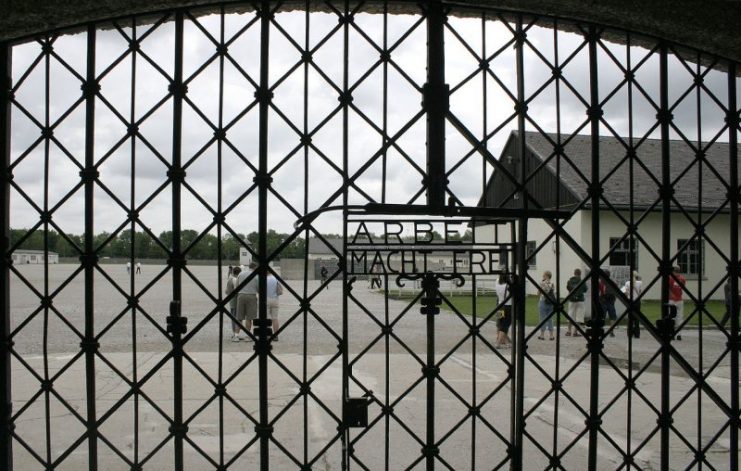 The main gate at Dachau concentration camp, marked with the slogan, Arbeit macht frei.