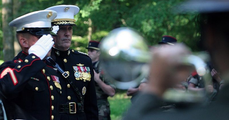 After laying a wreath in honor of the sacrifices made at Belleau during the First World War, Gen. Joseph Dunford, Assistant Commandant of the Marine Corps, salutes to the Marine memorial, “Iron Mike,” that is nestled on the sacred, historic battlefield of Belleau Wood.