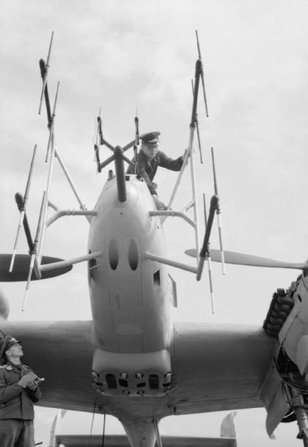 FuG 220 and FuG 202 (center) “Lichtenstein” SN-2 VHF band, and B/C UHF band night fighter radar antennas on the nose of a Bf 110 G-4 being serviced by Luftwaffe ground crew on Grove airfield, Denmark postwar in August 1945, before the aircraft was sent to the UK for research.