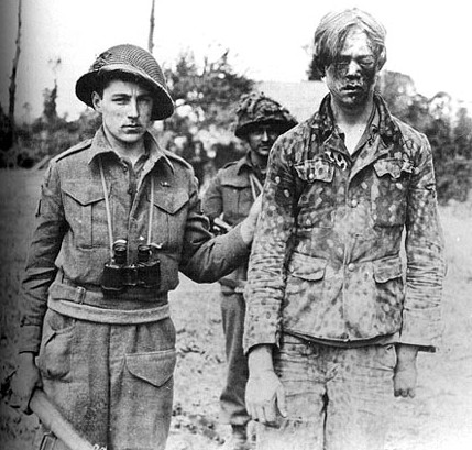 A captured Panzergrenadier of the Hitlerjugend taken by a Canadian Intelligence Unit during the fighting for Caen.