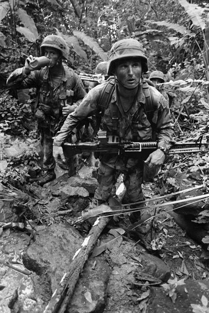 A machine gunner with the 82nd Airborne Division leads the way up a trail outside of Gamboa during Operation Strike Hold, an Army contingency exercise.