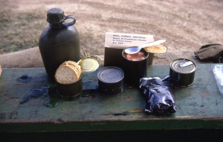 A United States Airman’s Meal, Combat, Individual ration (also called a C-Ration). DaNang, Vietnam, circa 1966–1967. The canteen was not part of the ration. Note the foil wrapped accessory pack.