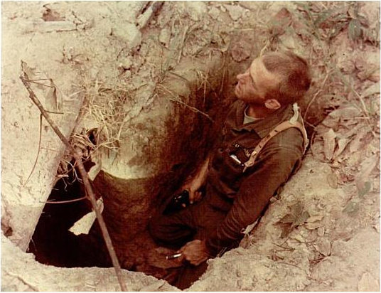 A US 1st Infantry Division soldier enters a tunnel during Operation Crimp.