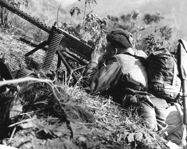 Soldier takes aim with a tripod-mounted M1919A4 in Korea, 1953