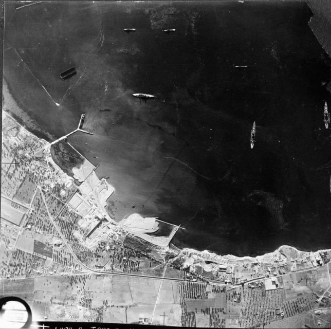 Aerial photo of Italian warships moored in Mar Grande harbor at Taranto. Note the ‘Y’ jetty.