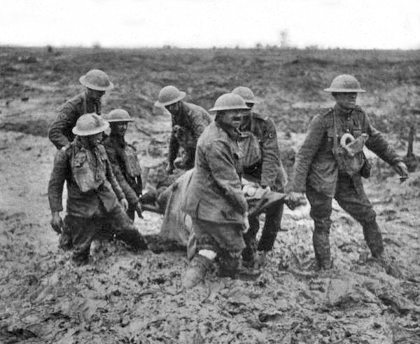 Battle of Pilckem Ridge 31 July – 2 August: stretcher bearers struggle in mud up to their knees to carry a wounded man to safety near Boesinghe on 1 August.