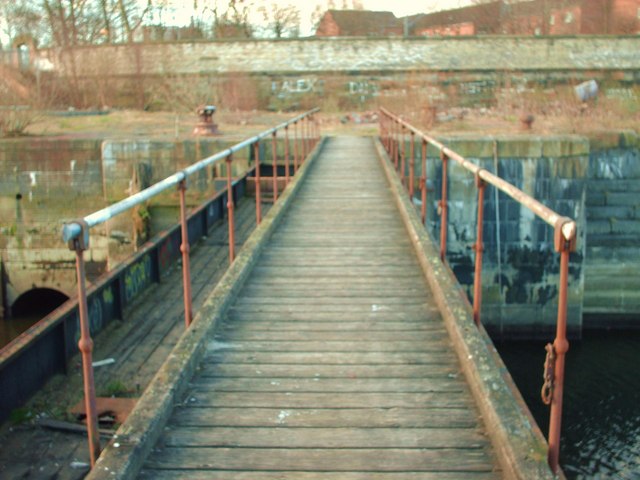 Bridge across the dock.In the past this bridge would have been raised to allow massive ships into Dry Dock number 3 at Govan Graving Dock. It would also act as a barrier to allow the massive dock to be split into two.Photo: Lynn M Reid CC BY-SA 2.0
