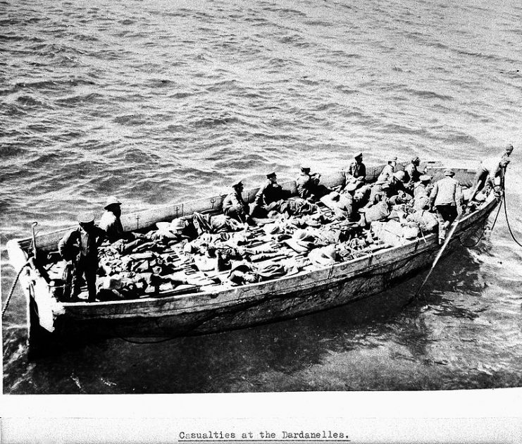 Casualties at the Dardanelles. Stretcher cases being carried in an open boat to the military hospital ship Dongola. 1915