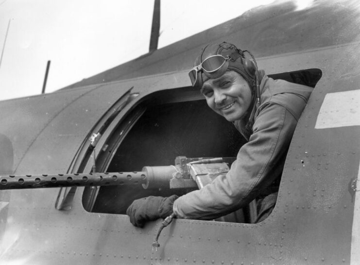 Clark Gable poking his head out of the window of an aircraft