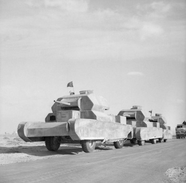 Dummy tanks, mounted on trucks, going to the forward areas on battlefields