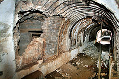 Entrance to Operation Tracer, Stay Behind Cave. Doorway is seen behind brickwork which has been partially removed.Photo: Jim Crone CC BY-SA 3.0