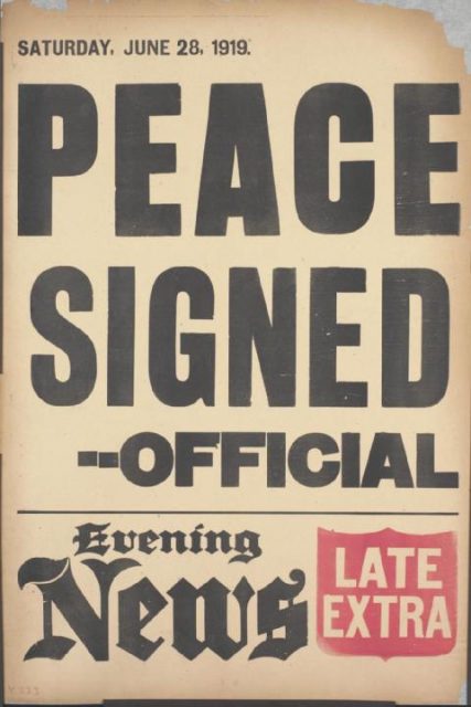 A British news placard announces the signing of the peace treaty.