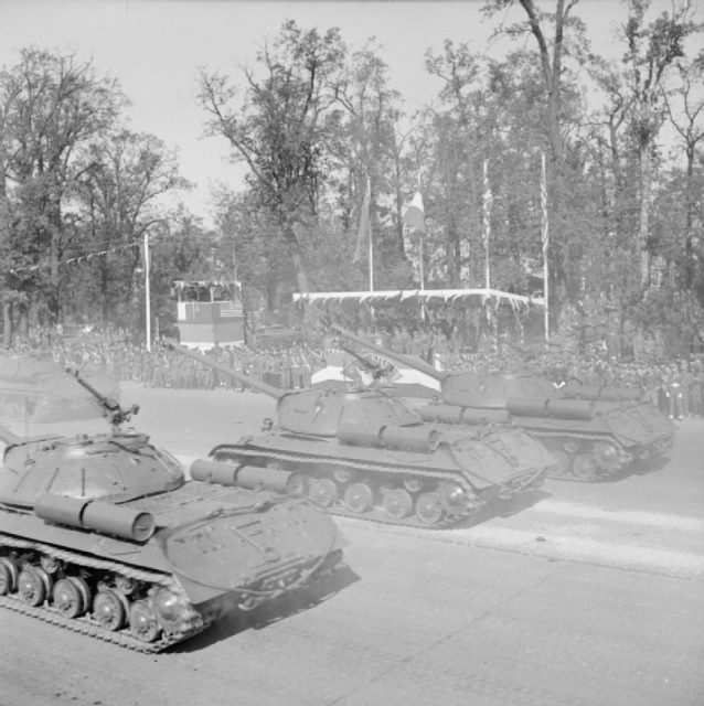 Soviet IS-3 Heavy Tanks pass the saluting base on the Charlottenburg Chaussee in Berlin during the Four Nations VJ Day parade.